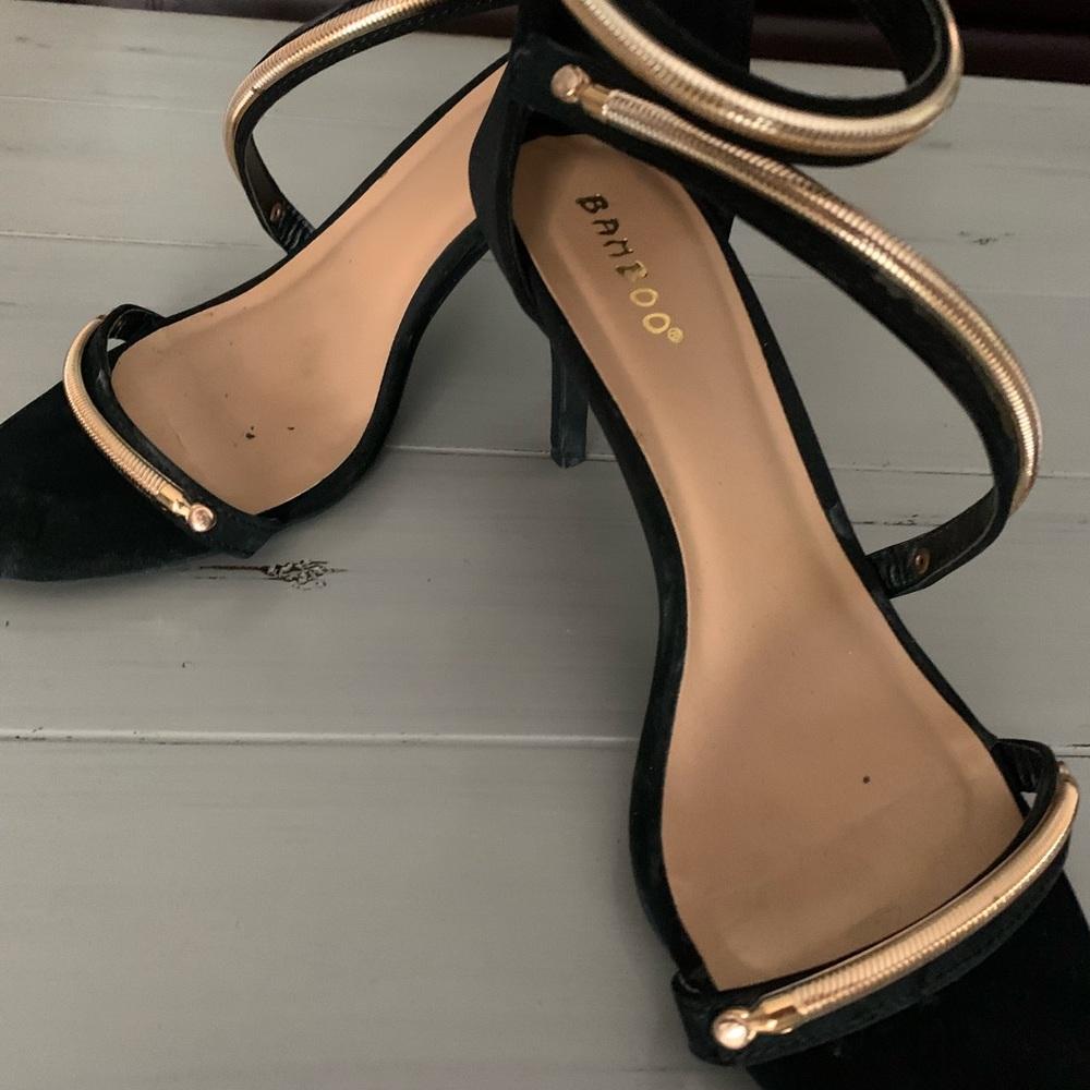 Stylish black and gold strappy sandals